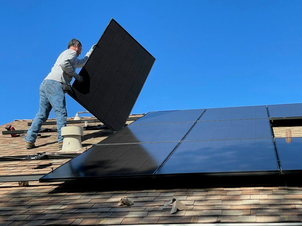 Solar panels during installation on a residential roof