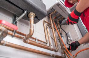 Plumber inspecting a gas line