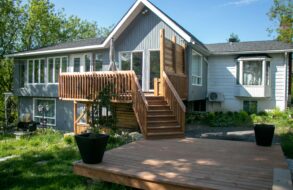 Large wood deck with stairs and a lower patio