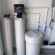 Leaf Home Water Softener installed in a garage