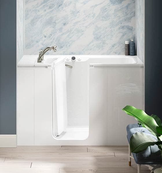 Kohler Walk-In Tub in alcove with blue marble walls
