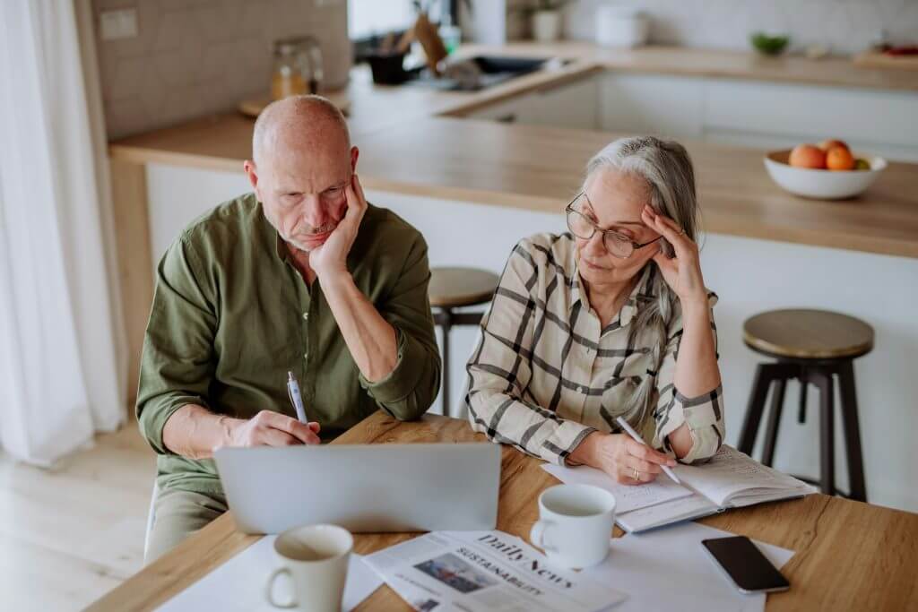 Couple at computer exploring financing options