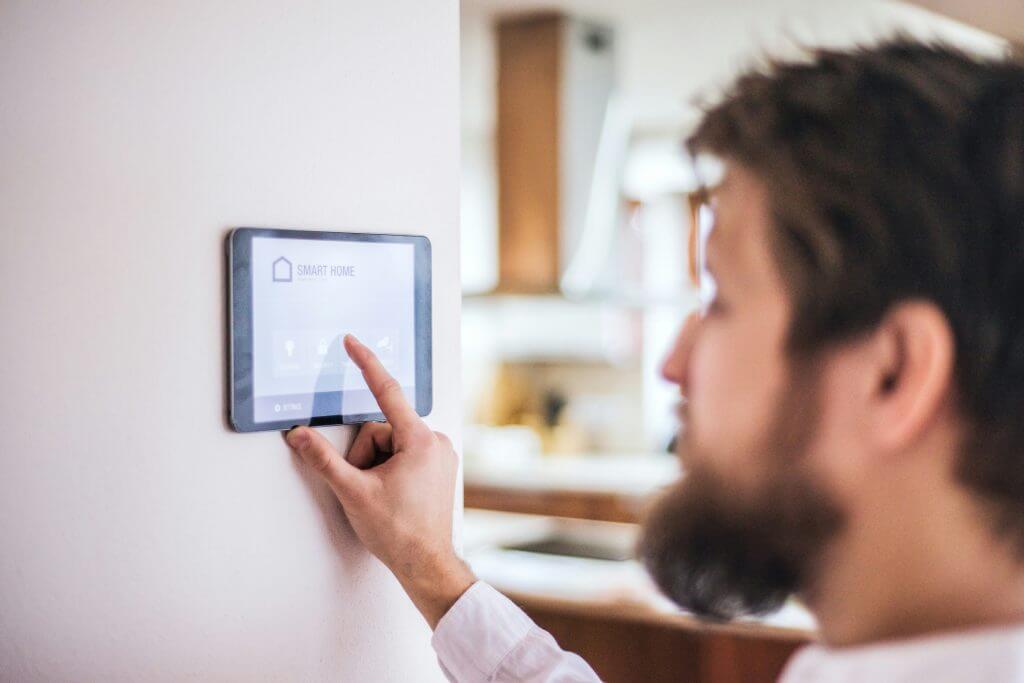Person putting security code into touchpad system