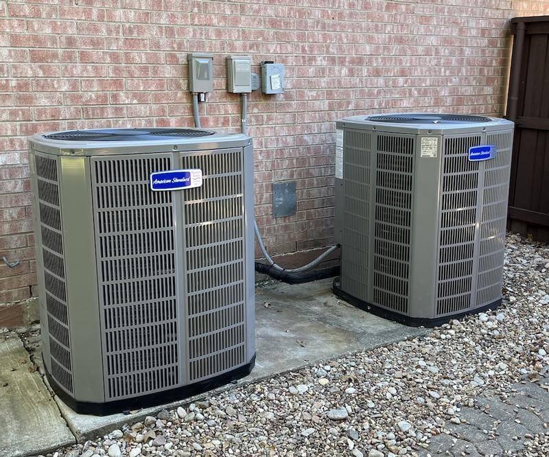 American Standard Platinum 20 Heat Pump installed outside a brick home