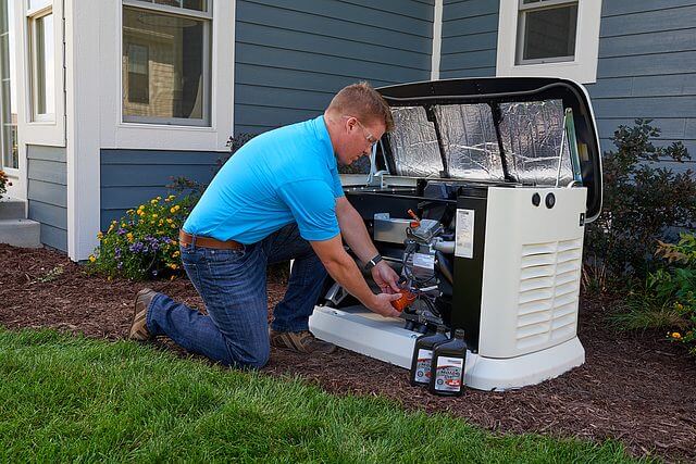 Professional installing a standby generator