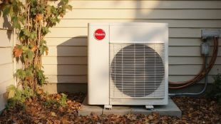 Rheem heat pump installed on the exterior of a home