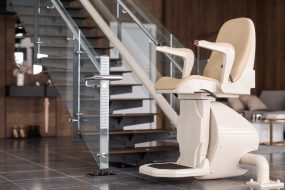 Close-up View Of Automatic Stair Lift On Staircase With Blurred Background