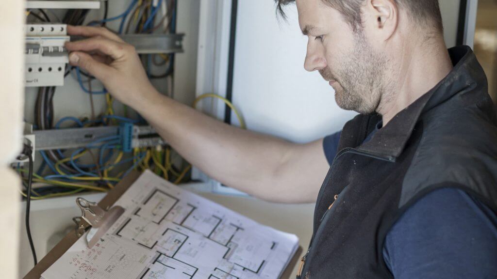 Contractor using plans to investigate system