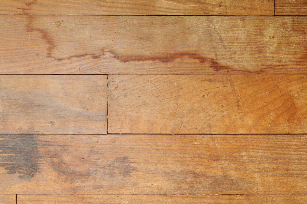 Water-damaged, stained hardwood floor