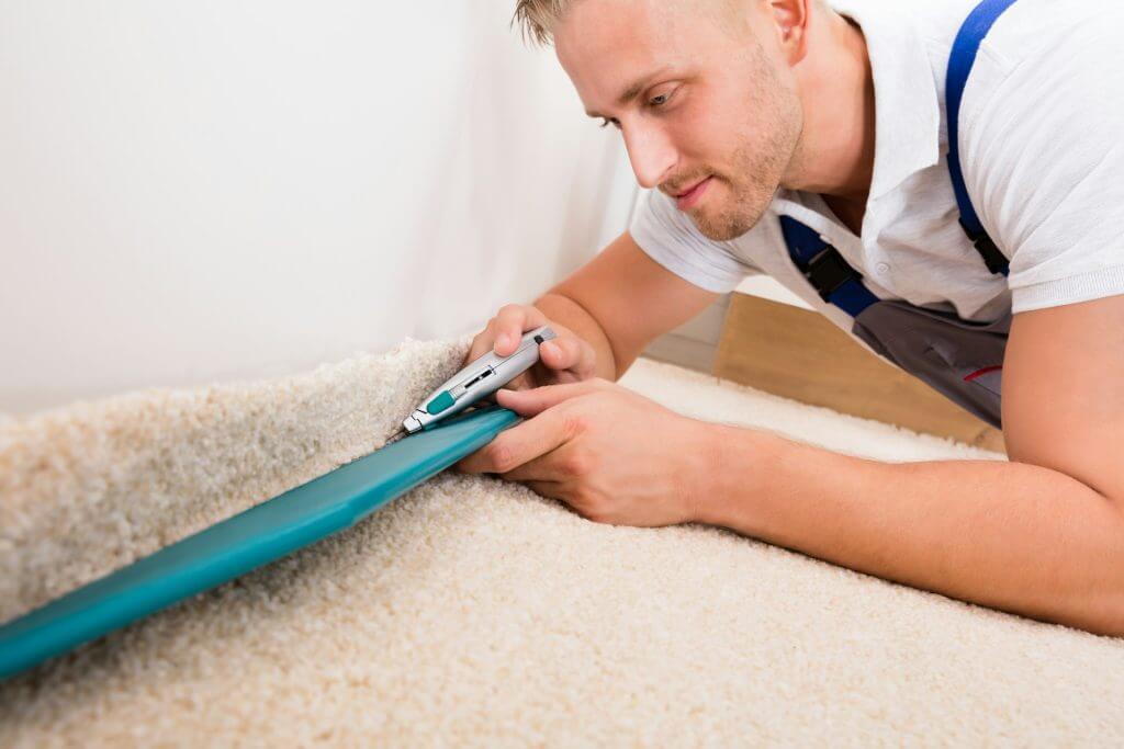 Carpet repair in progress by a technician