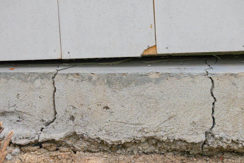 a house foundation that cracks due to unstable soil conditions