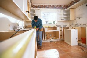 Man Measuring Counter for Kitchen Renovation