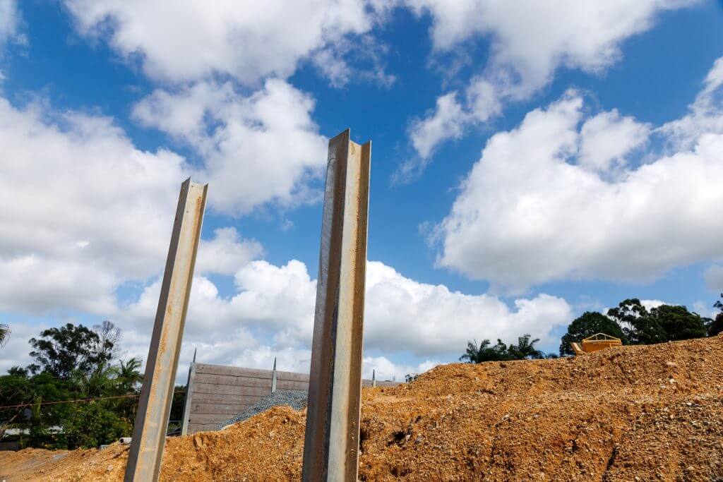 Steel posts used for retaining wall on development site