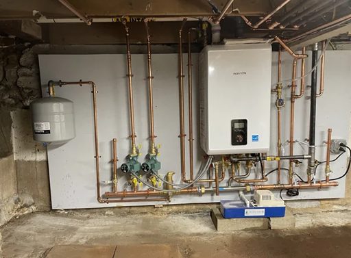 Navien boiler installed on the wall with copper piping