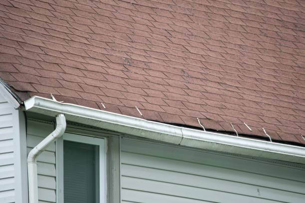 A gutter sagging and pulling away from the house