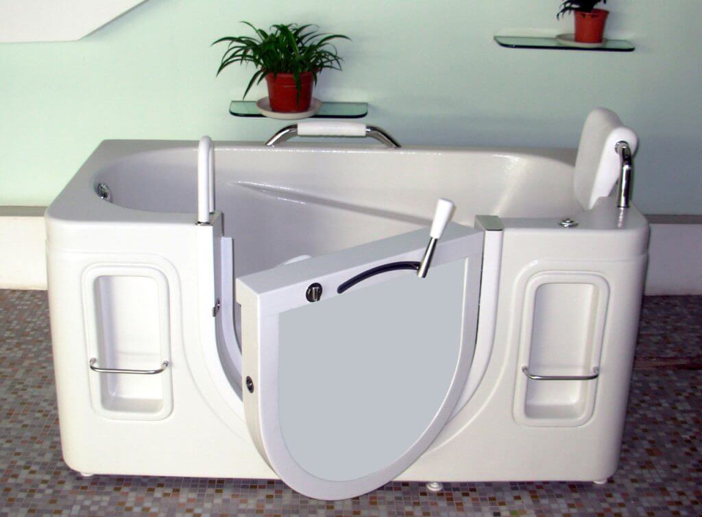 Walk-in tub featuring an outward swinging door and cushioned headrest