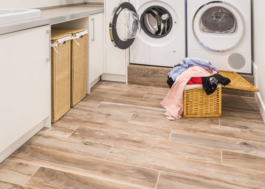 Dedicated laundry room with vinyl floors and good organization